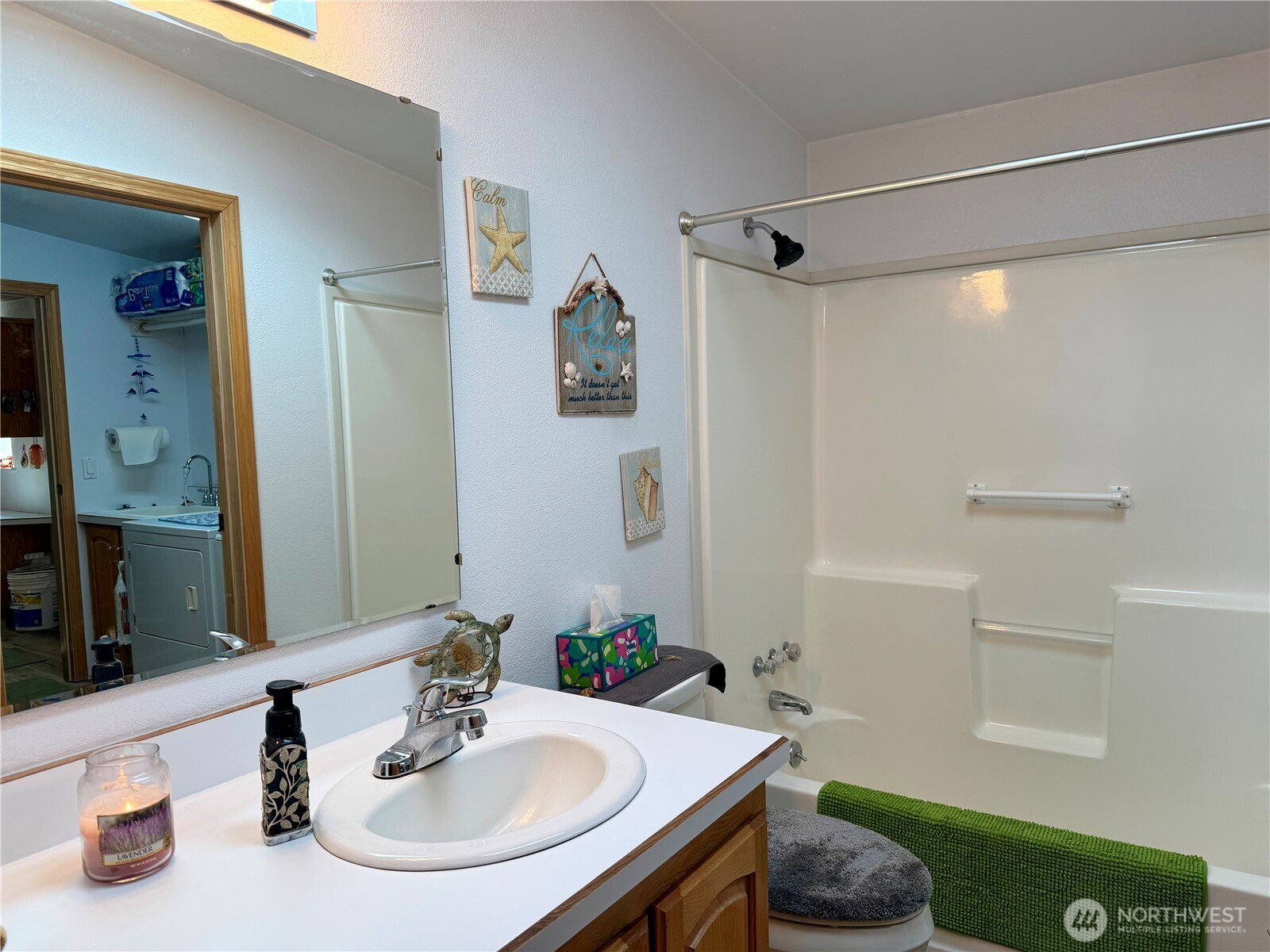 505 Northwest Portland Street Wilbur, WA 99185 - Photo 27 of 40 a bathroom with a sink and a mirror