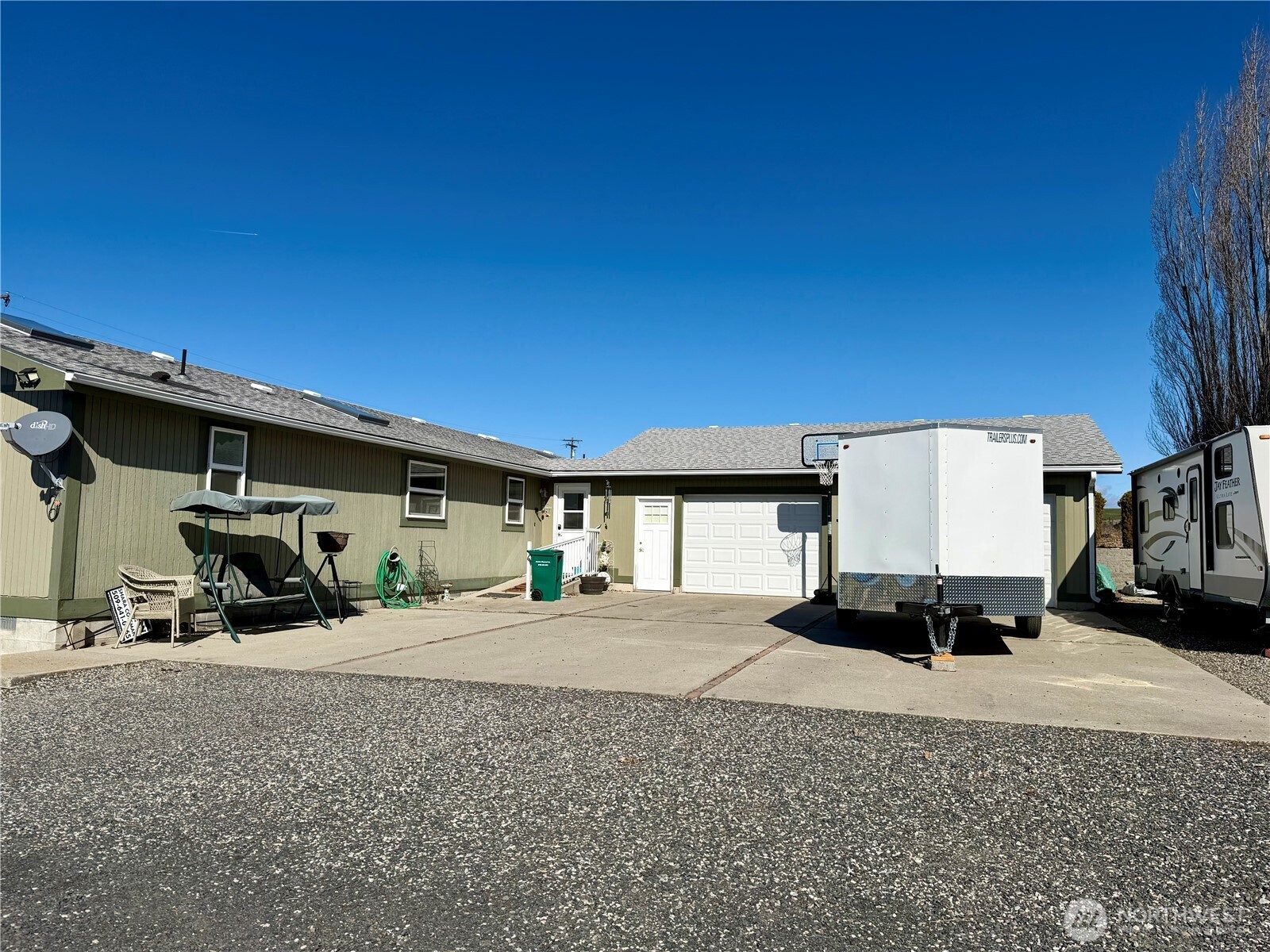 505 Northwest Portland Street Wilbur, WA 99185 - Photo 38 of 40 a car parked in parking area next to a building