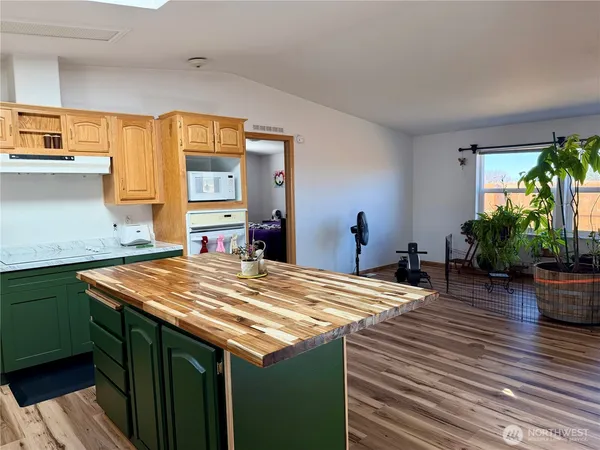 a room with pool table and windows