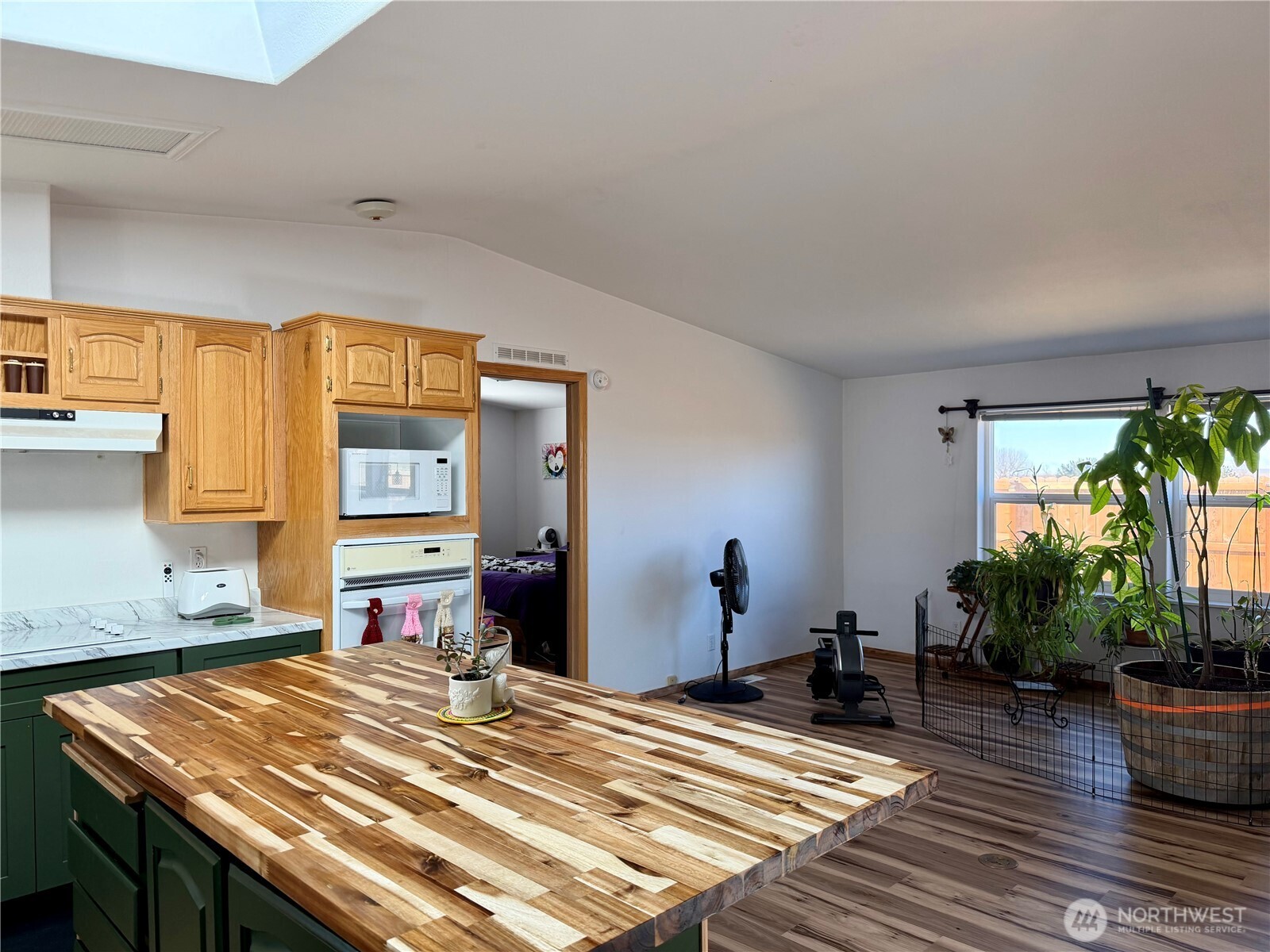 505 Northwest Portland Street Wilbur, WA 99185 - Photo 5 of 40 a bed room with a bed and a potted plant