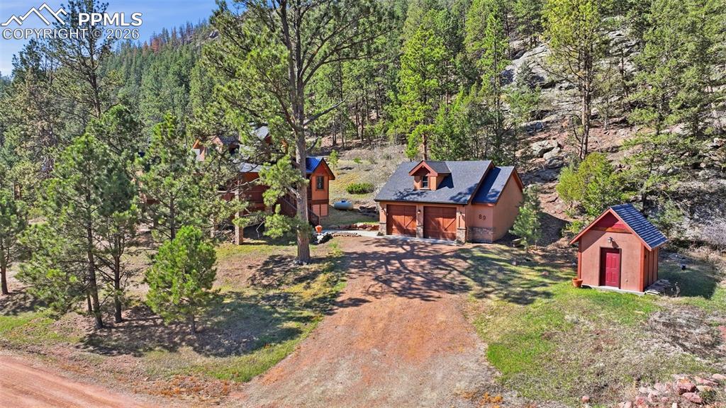 89 Ranch View Road Florissant, CO 80816 - Photo 2 of 50 This manor features a beautifully crafted home, matching detached 2 1/2 car garage, and a generously sized shed .