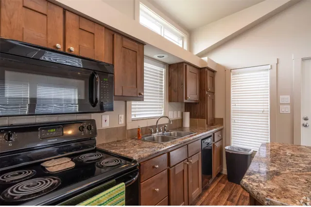 a kitchen with a stove and a microwave