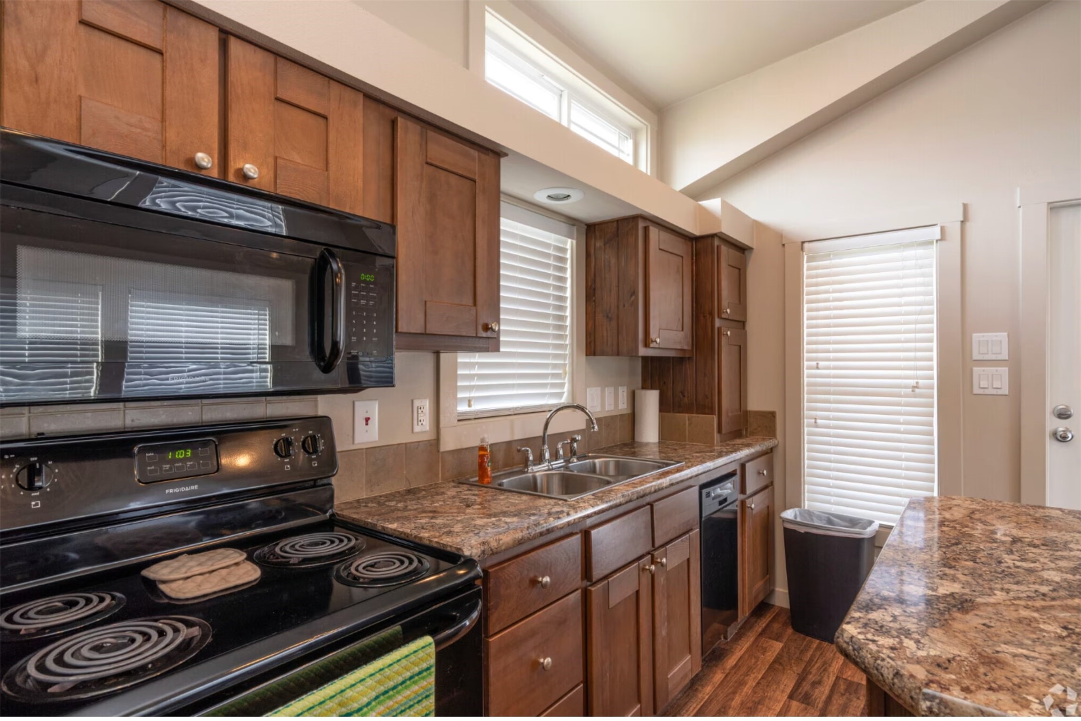3127 Maverick Loop, Unit 36 Freeport, TX 77541 - Photo 3 of 16 a kitchen with a stove and a microwave