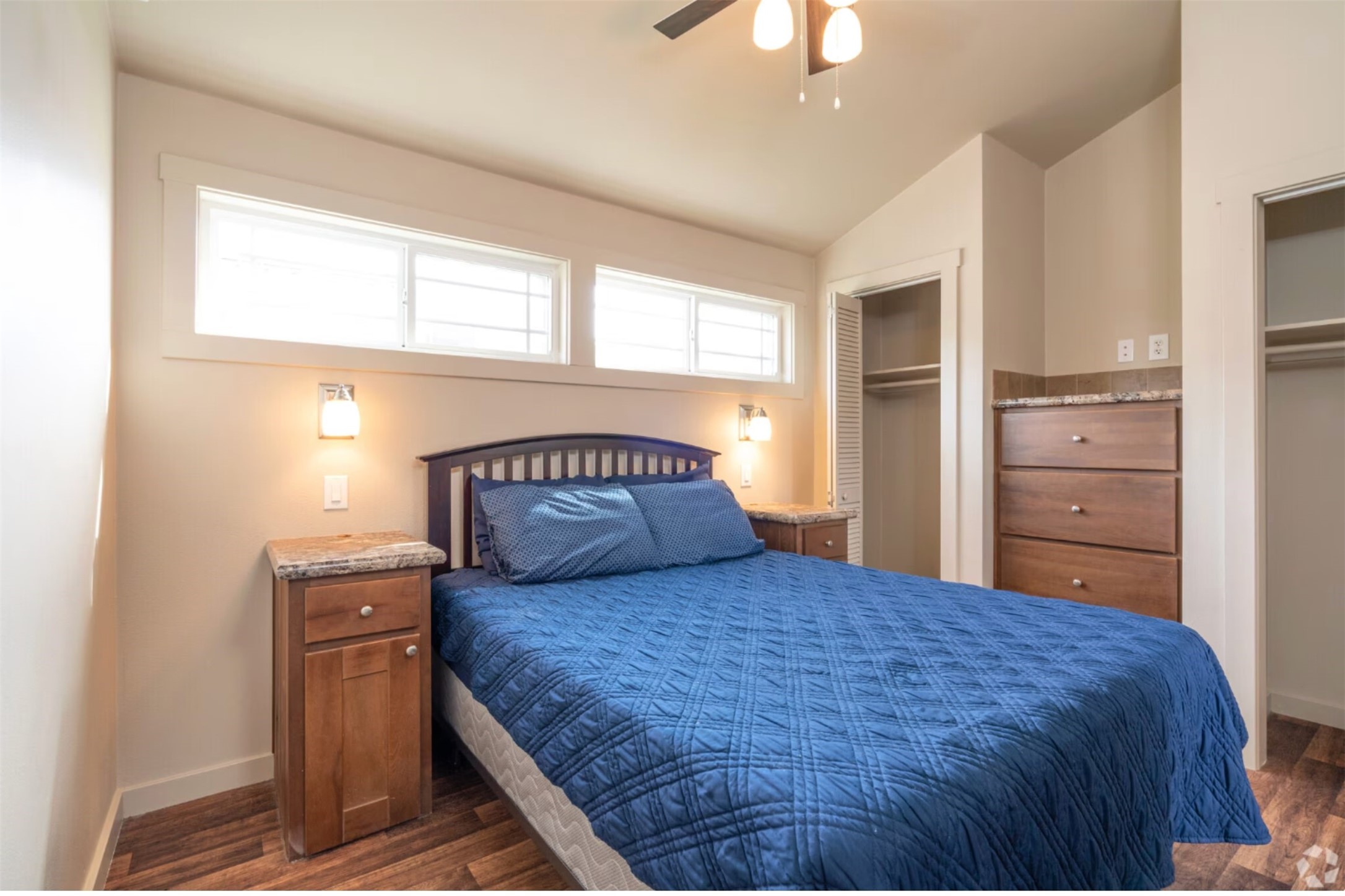 3127 Maverick Loop, Unit 36 Freeport, TX 77541 - Photo 5 of 16 a bedroom with a large bed and a chandelier