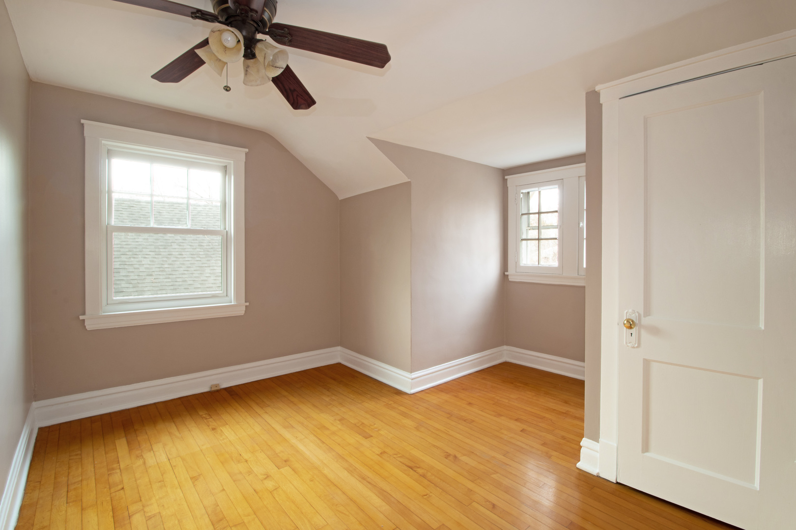 261 Blackhawk Road Riverside, IL 60546 - Photo 16 of 31 a view of empty room with wooden floor and fan