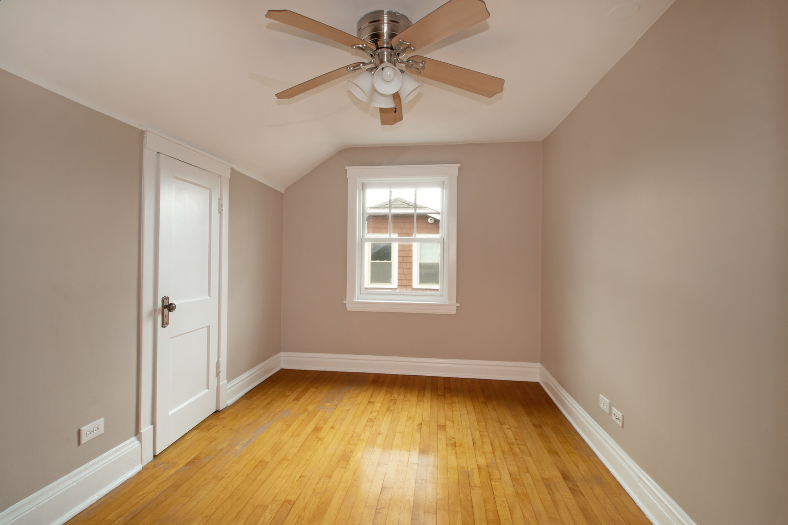 261 Blackhawk Road Riverside, IL 60546 - Photo 17 of 31 an empty room with a window and a ceiling fan