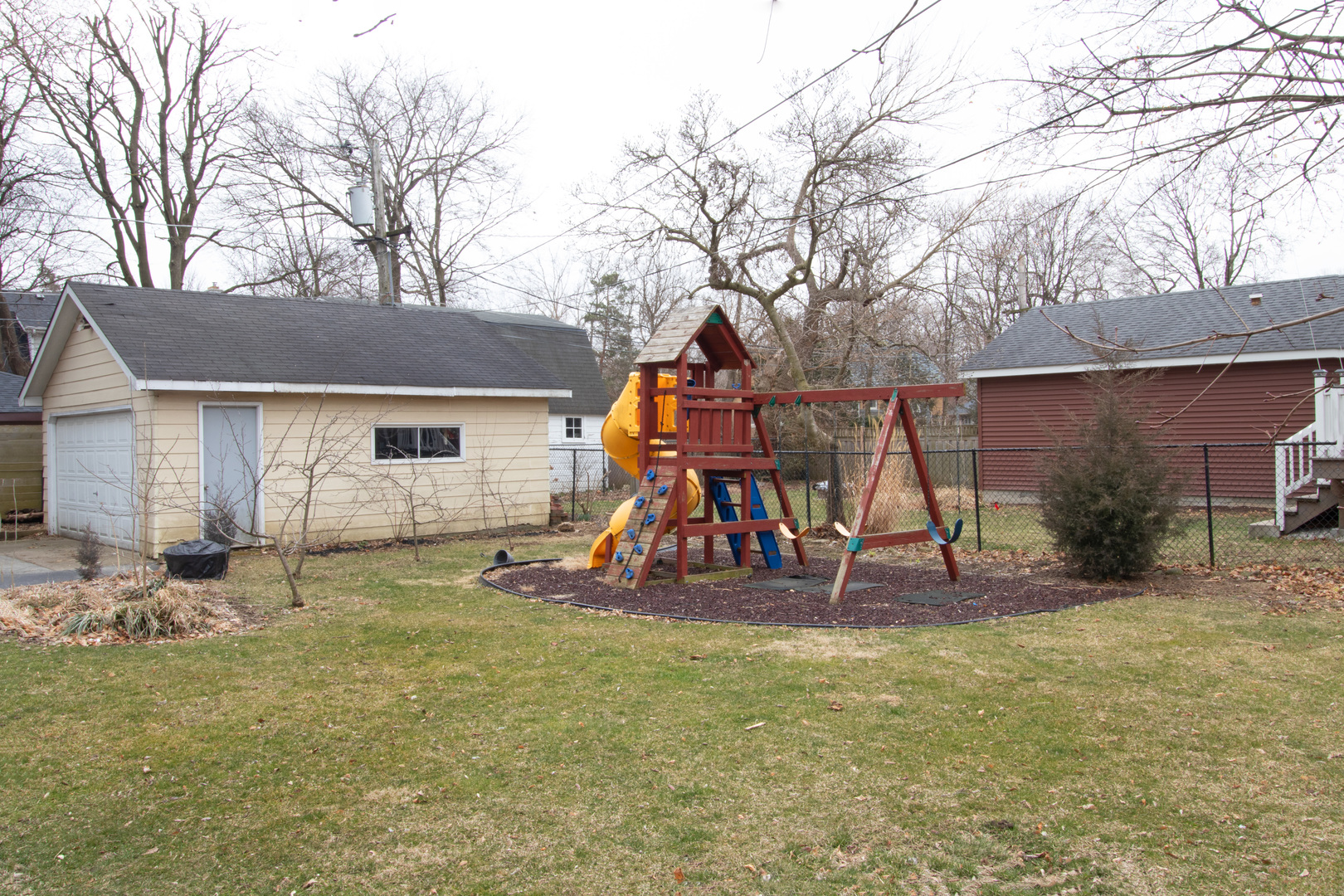 261 Blackhawk Road Riverside, IL 60546 - Photo 24 of 31 a view of a backyard with a slide