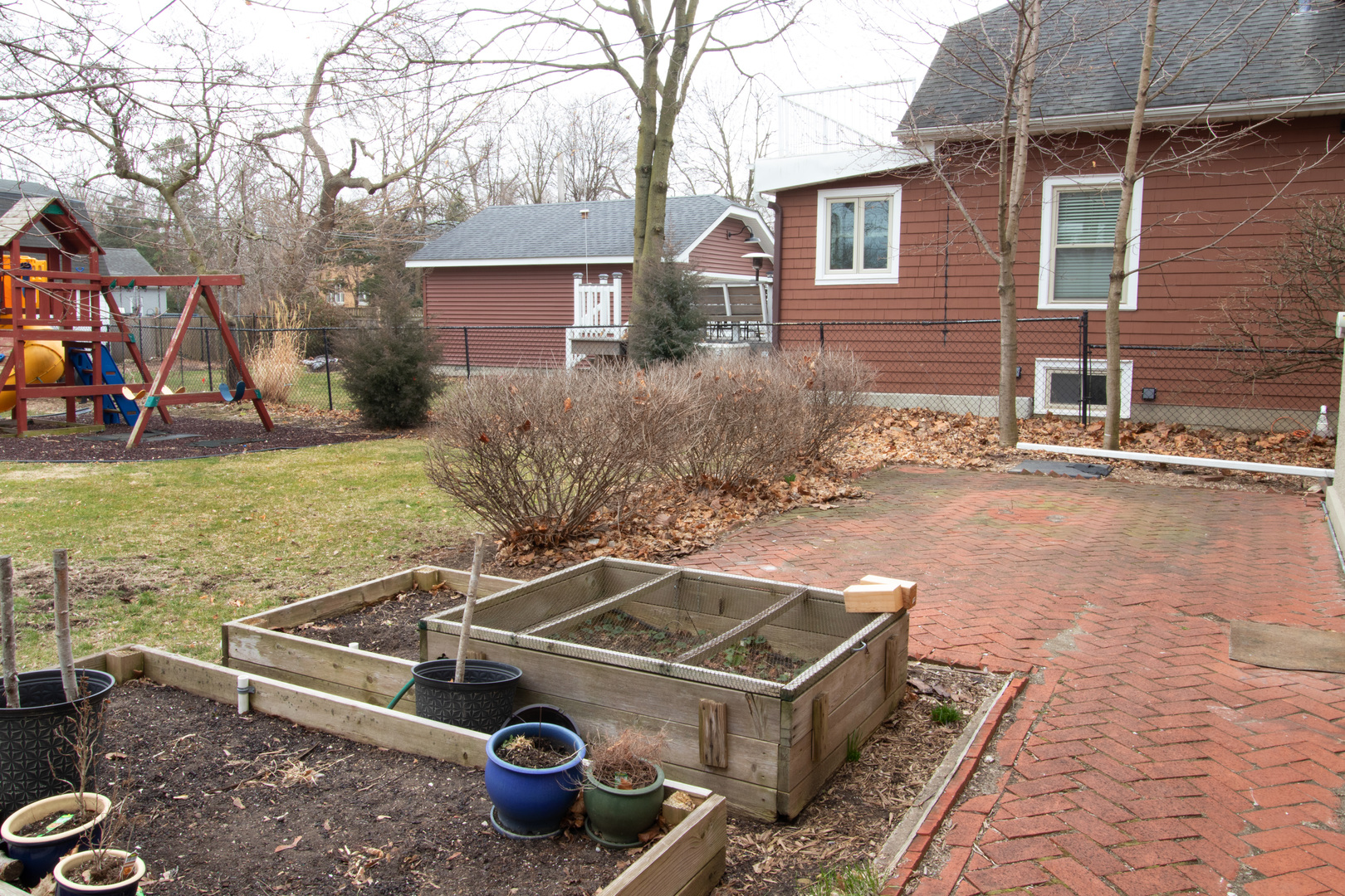 261 Blackhawk Road Riverside, IL 60546 - Photo 25 of 31 a front view of a house with garden