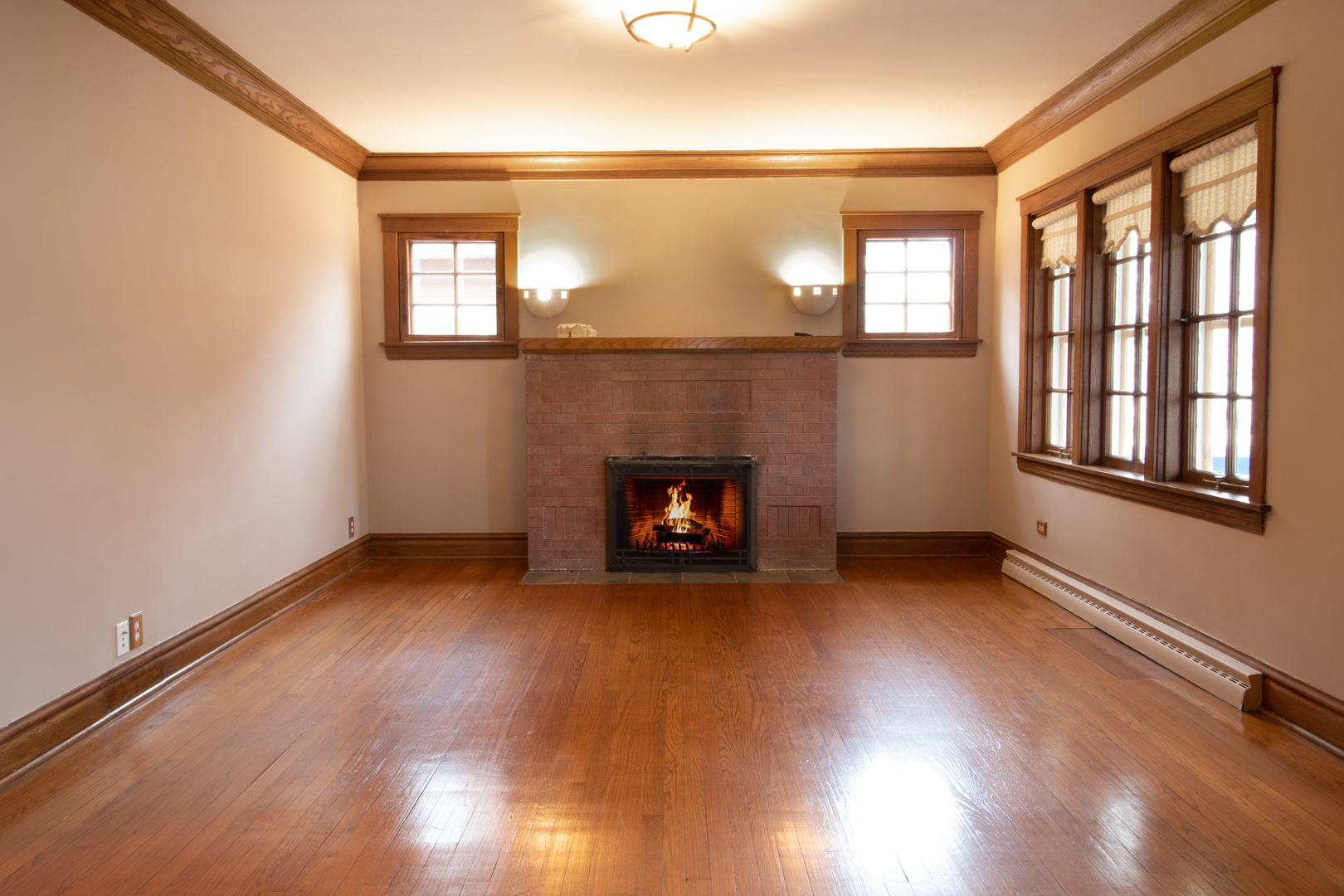 261 Blackhawk Road Riverside, IL 60546 - Photo 5 of 31 a view of an empty room with wooden floor and a window