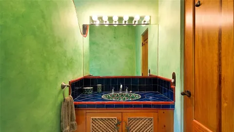 a bathroom with a bathtub and shower