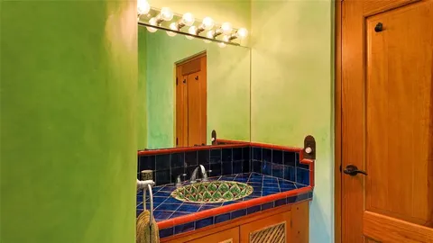 a bathroom with a tub and a sink