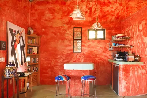 a dining room with a table and chairs