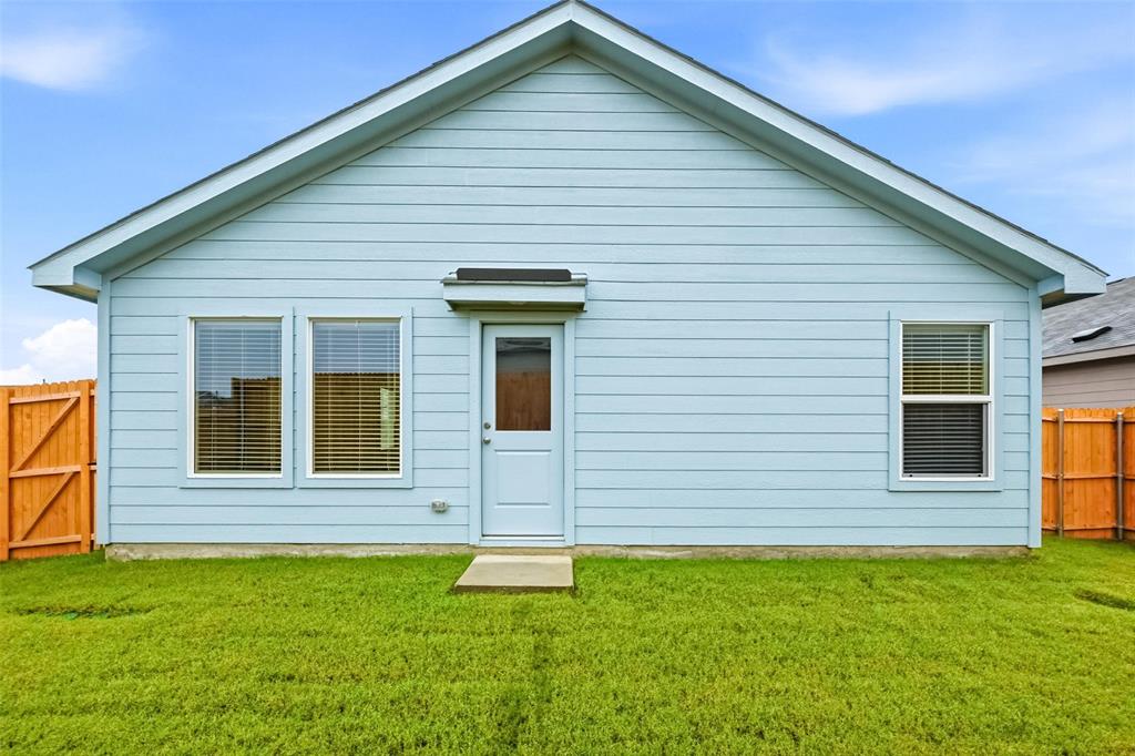 1037 Raintree Road Princeton, TX 75407 - Photo 18 of 21 a view of a house with a backyard