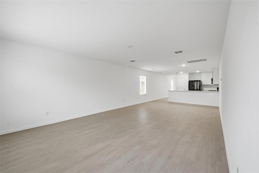 1037 Raintree Road Princeton, TX 75407 - Photo 3 of 21 a view of a kitchen with a sink and a window