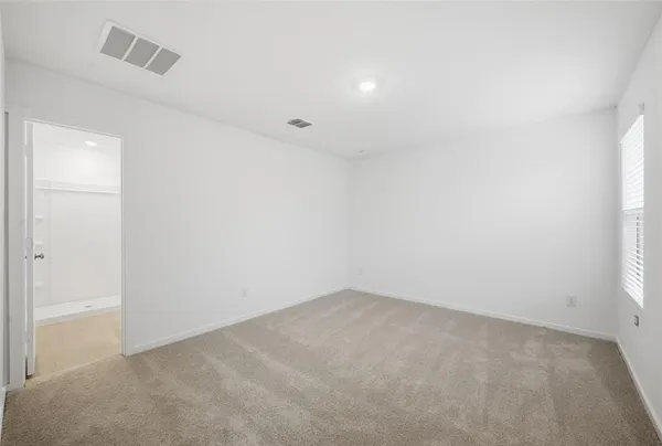 an empty room with a empty space and window