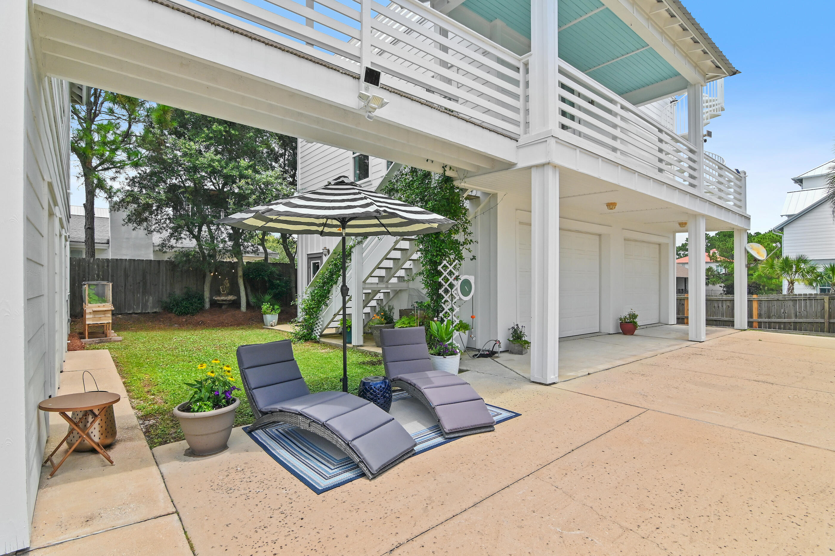 96 Hilltop Drive Santa Rosa Beach, FL 32459 - Photo 46 of 50 a view of a patio with couches chairs and a table and chairs