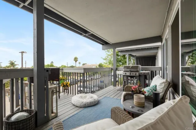 a view of a living room and balcony