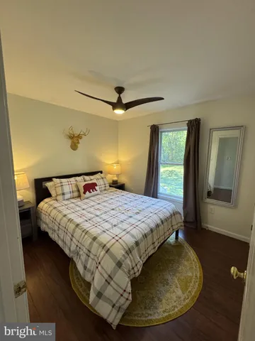 a bedroom with a bed and a table in it