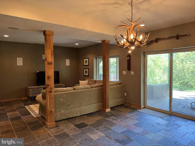 a view of two chairs in the patio