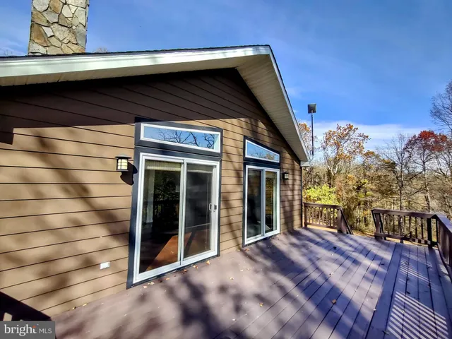 a view of a forest from a balcony