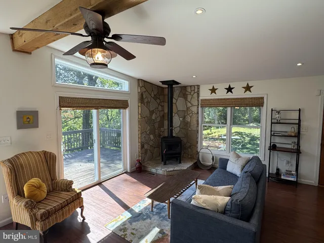 a kitchen with a table chairs and refrigerator