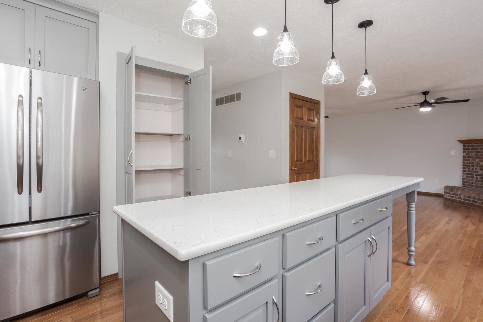 814 Landau Lane Normal, IL 61761 - Photo 25 of 58 a kitchen with a refrigerator a sink and wooden floor