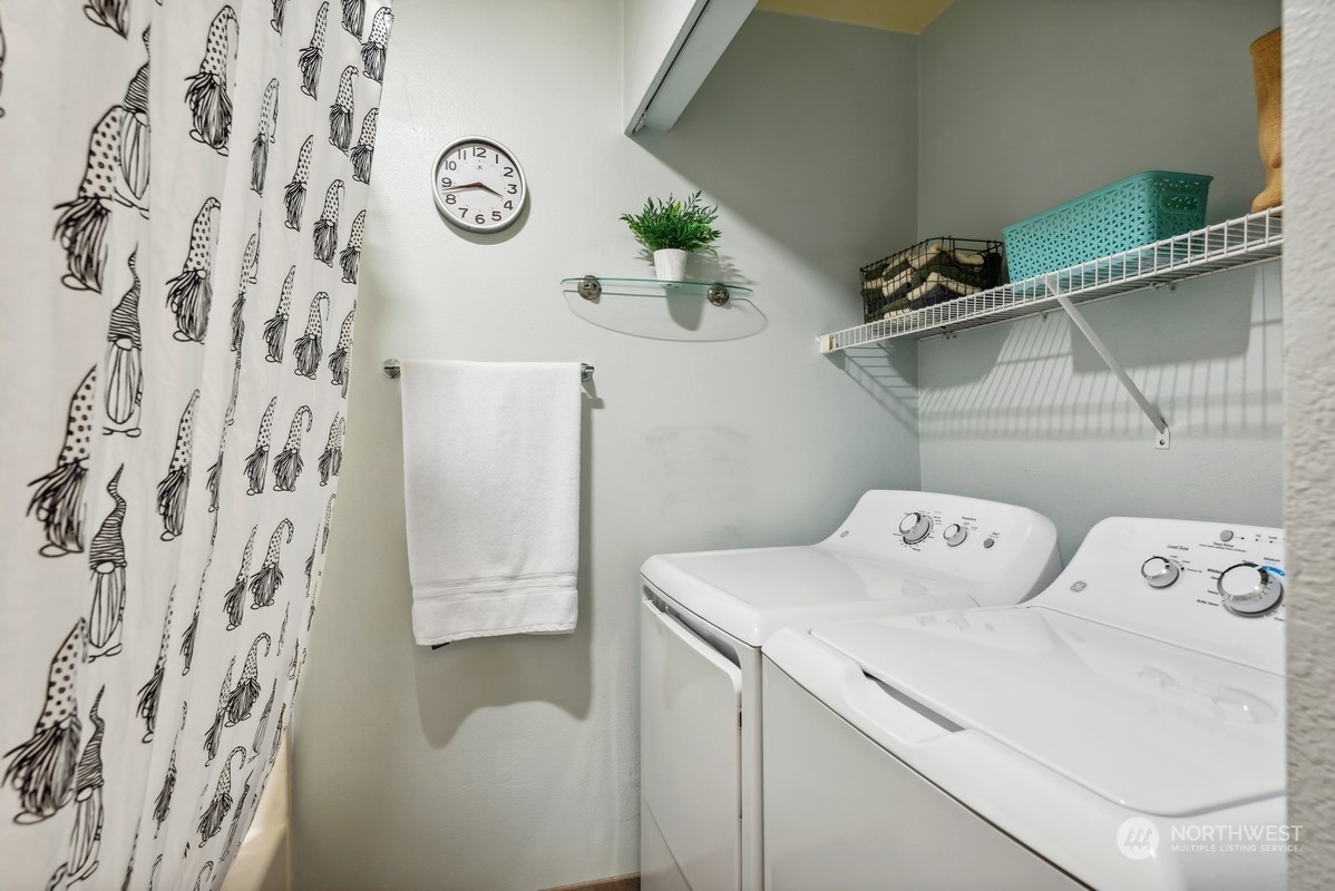 10709 Valley View Road, Unit C103 Bothell, WA 98011 - Photo 13 of 30 a utility room with dryer and washer