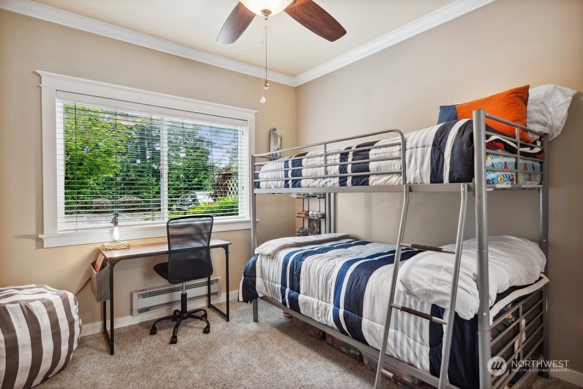 10709 Valley View Road, Unit C103 Bothell, WA 98011 - Photo 10 of 30 a bedroom with a bed and wooden floor