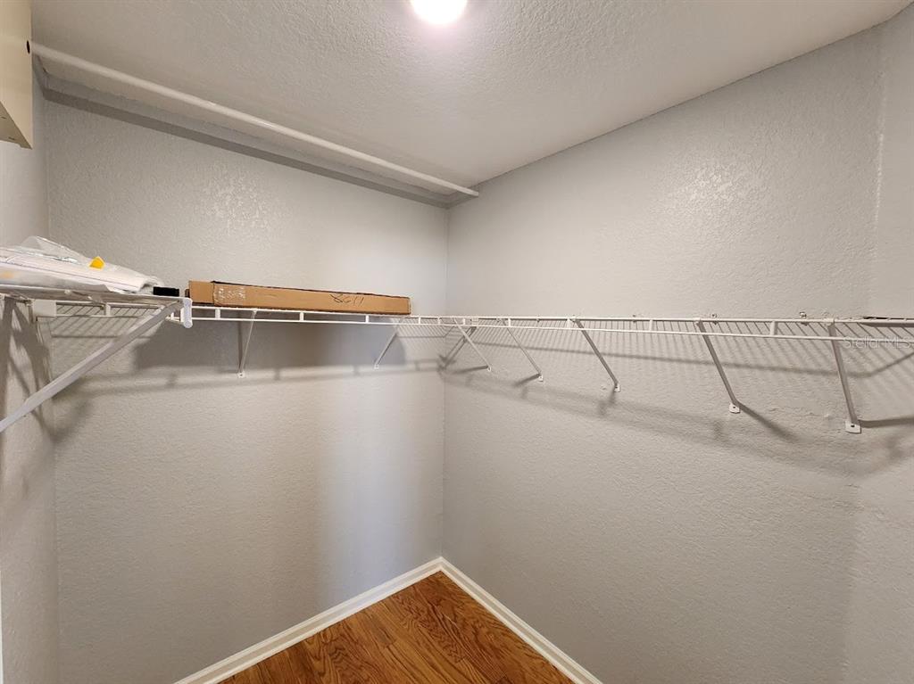 7511 Bayport Road, Unit 5 Orlando, FL 32819 - Photo 15 of 26 a view of a room with racks on the wall