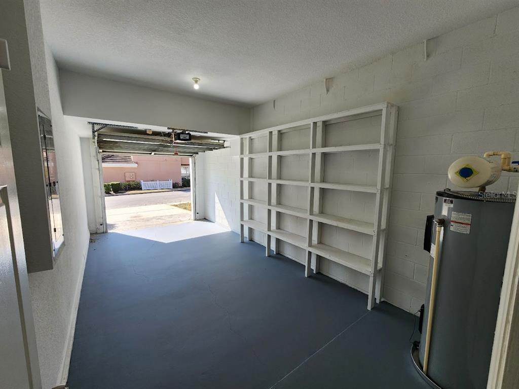 7511 Bayport Road, Unit 5 Orlando, FL 32819 - Photo 16 of 26 a view of walk in closet with empty racks