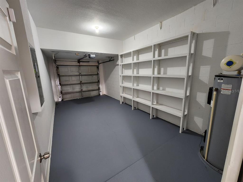 7511 Bayport Road, Unit 5 Orlando, FL 32819 - Photo 17 of 26 a view of walk in closet with empty racks