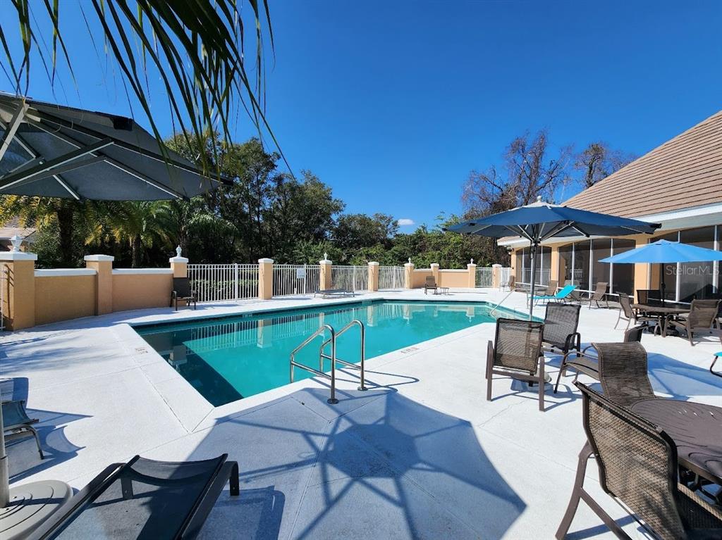 7511 Bayport Road, Unit 5 Orlando, FL 32819 - Photo 19 of 26 a view of a patio with swimming pool