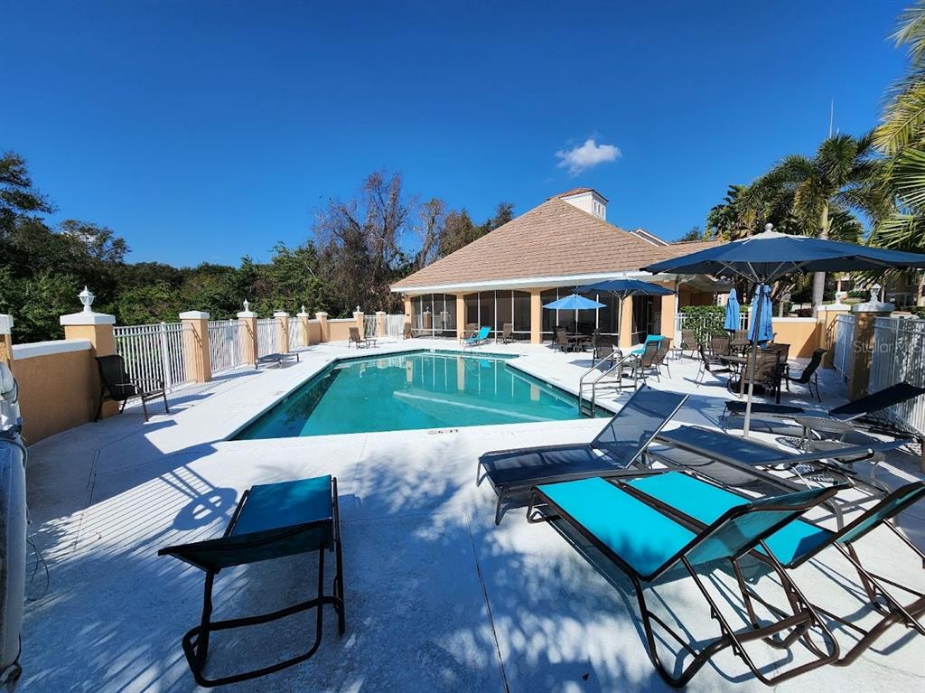 7511 Bayport Road, Unit 5 Orlando, FL 32819 - Photo 21 of 26 a building outdoor space with patio furniture