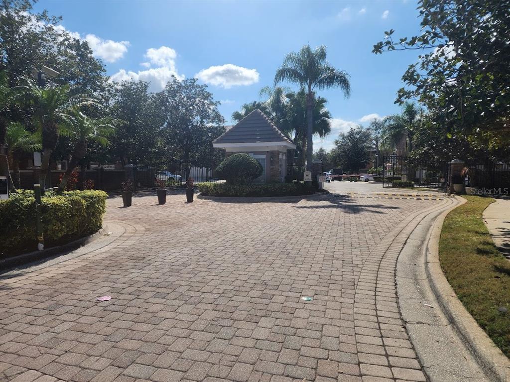 7511 Bayport Road, Unit 5 Orlando, FL 32819 - Photo 25 of 26 a view of road with large trees
