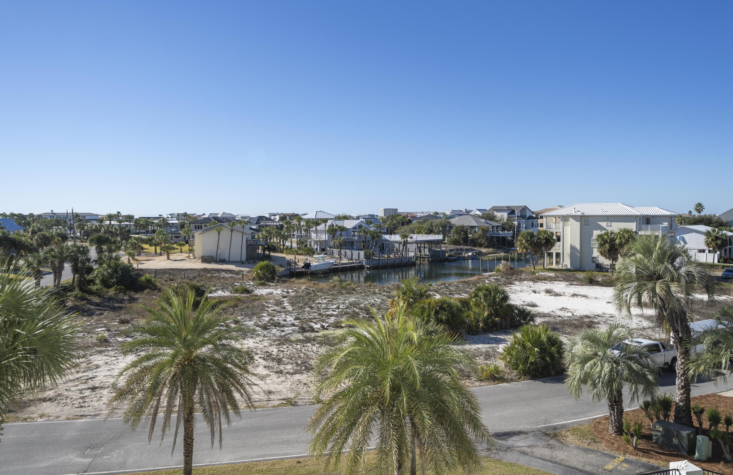 30 Moreno Point Road, Unit 404A Destin, FL 32541 - Photo 34 of 52 a view of a lake with a city