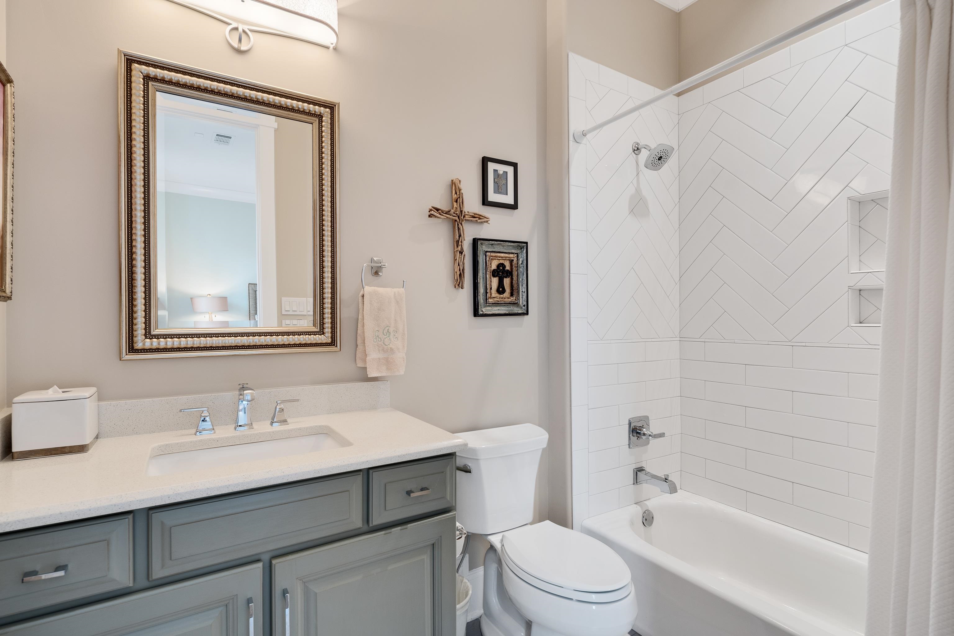 770 Ballard Road Piperton, TN 38017 - Photo 25 of 40 a bathroom with a granite countertop sink a toilet and shower
