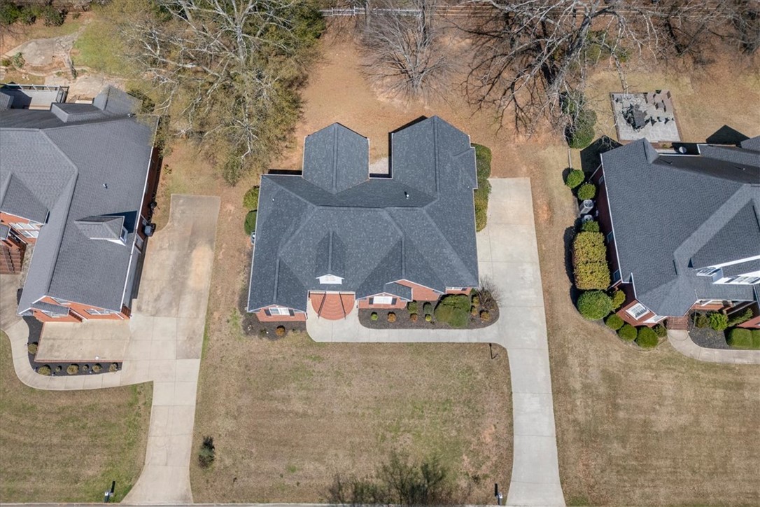128 Cayman Way Anderson, SC 29621 - Photo 38 of 49 An aerial view captures the residential property with its spacious driveways and well-maintained landscape.