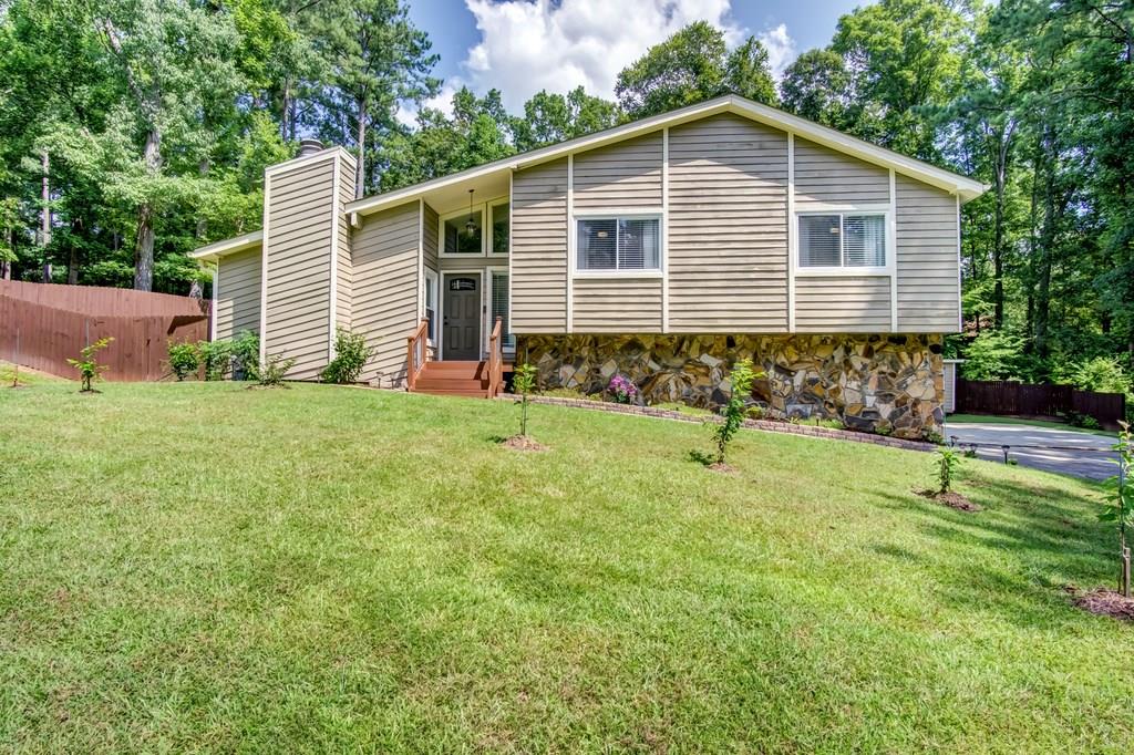 324 Northland Road Southwest Mableton, GA 30126 - Photo 1 of 1 a view of a backyard with a garden and plants