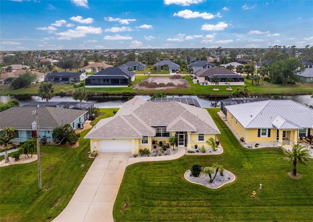 233 Marker Road Rotonda West, FL 33947 - Photo 1 of 1 an aerial view of residential houses with outdoor space and lake view