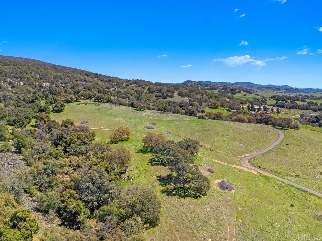 25677 Mesa Grande Road Santa Ysabel, CA 92070 - Photo 7 of 28 a view of a lake with a mountain in the background