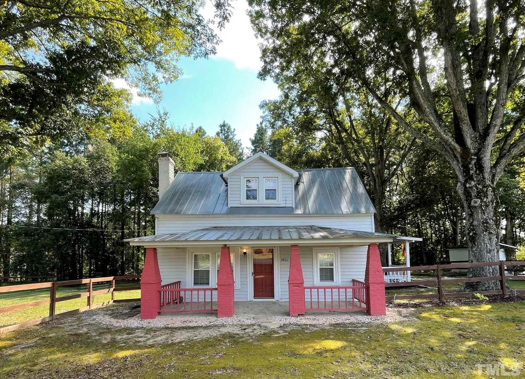 4821 Purnell Road Wake Forest, NC 27587 - Photo 2 of 19 a front view of house with yard swimming pool and outdoor seating