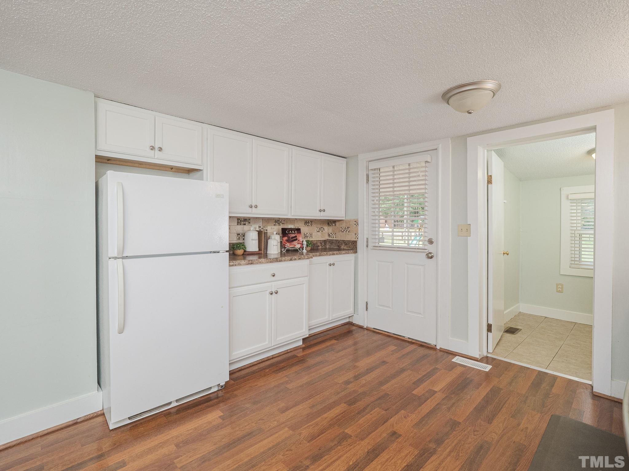 4821 Purnell Road Wake Forest, NC 27587 - Photo 15 of 19 a kitchen with a refrigerator and a refrigerator
