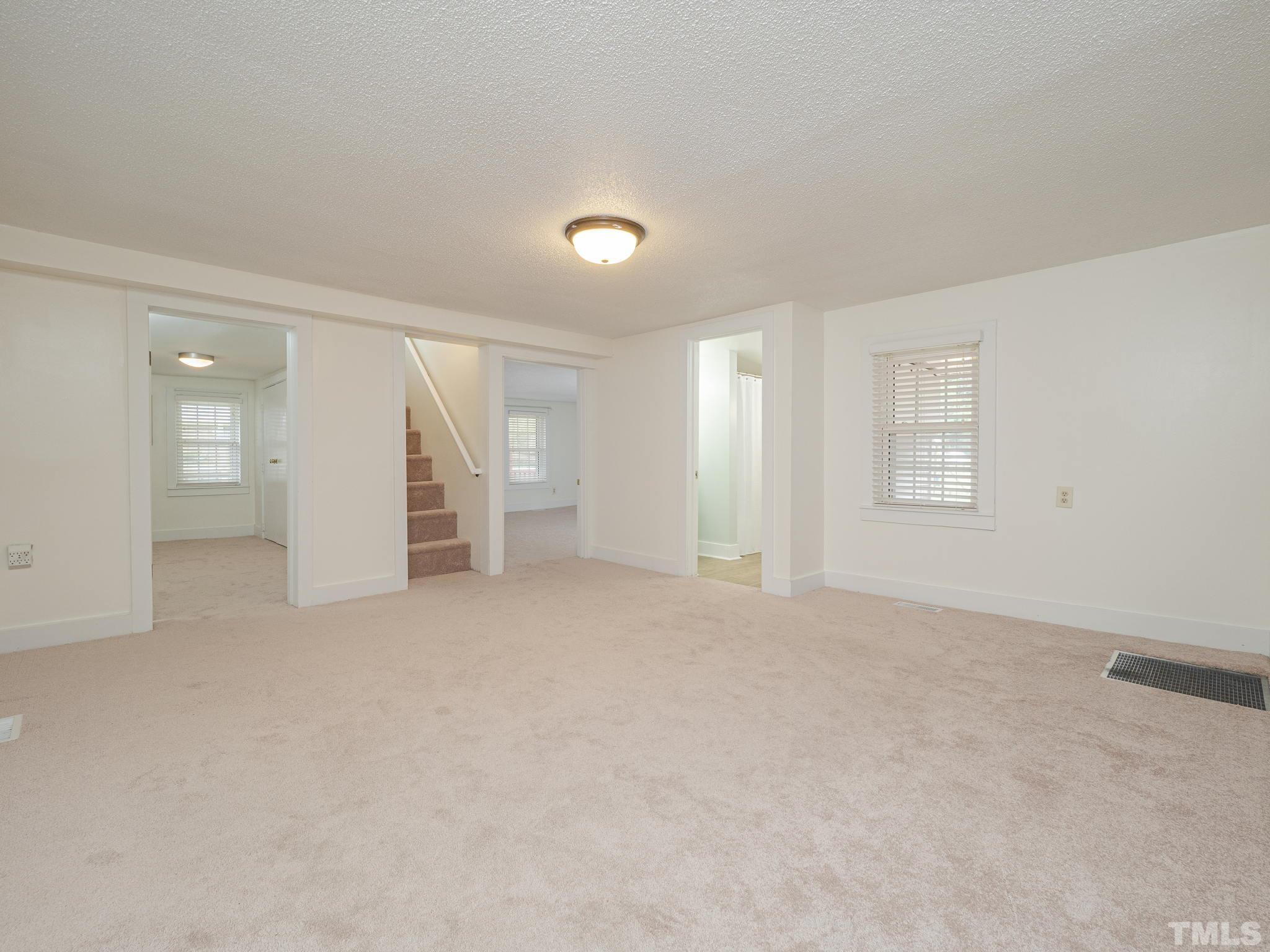 4821 Purnell Road Wake Forest, NC 27587 - Photo 19 of 19 wooden floor in an empty room with a window