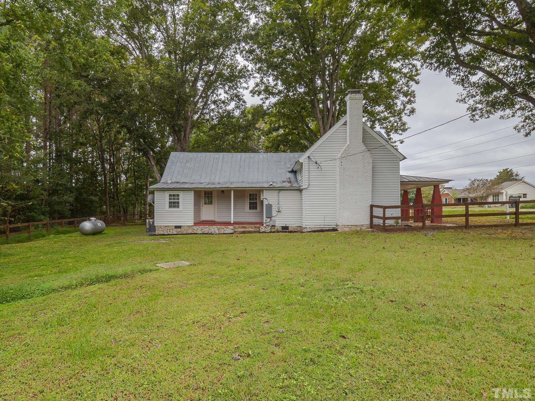 4821 Purnell Road Wake Forest, NC 27587 - Photo 7 of 19 a view of a house with a yard patio and sitting area