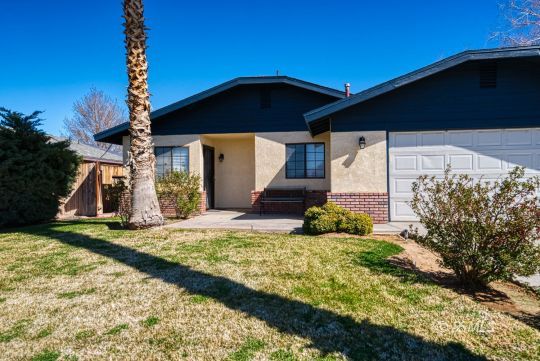 318 Reese Street Ridgecrest, CA 93555 - Photo 22 of 34 a front view of a house with garden