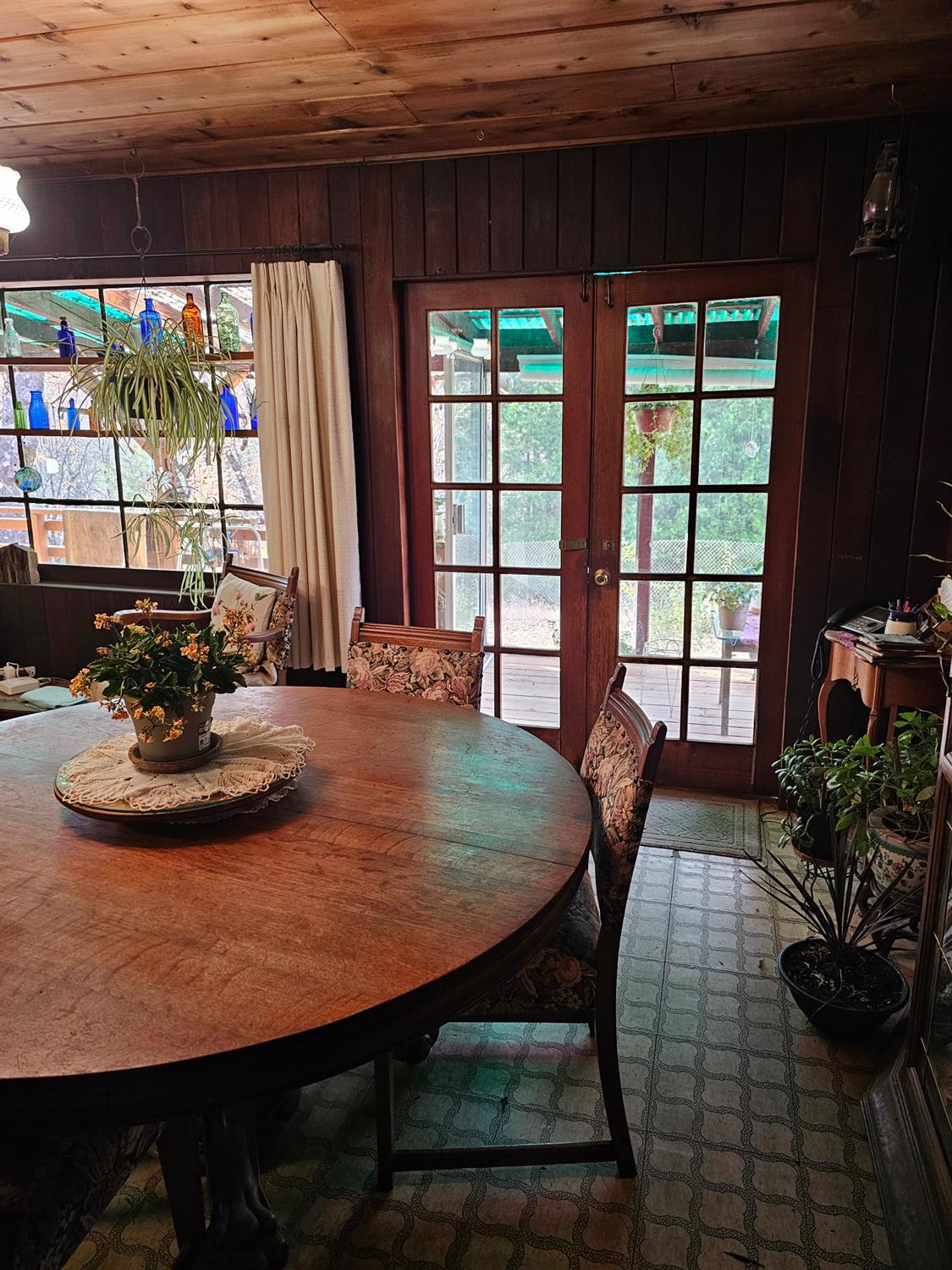 250 Acorn Way West Point, CA 95255 - Photo 11 of 32 a dining room with furniture and a potted plant