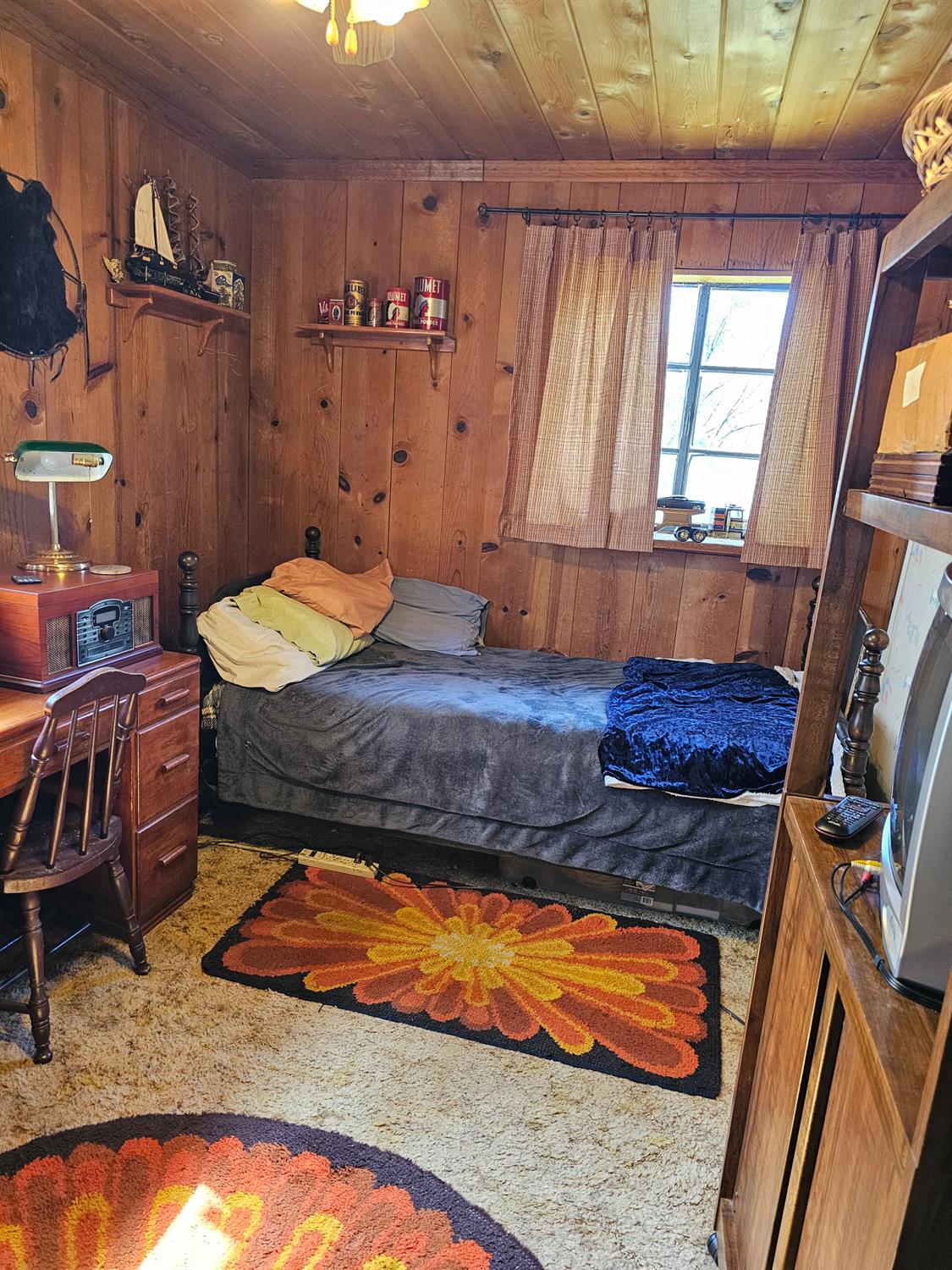 250 Acorn Way West Point, CA 95255 - Photo 15 of 32 a bed sitting in a room next to a window