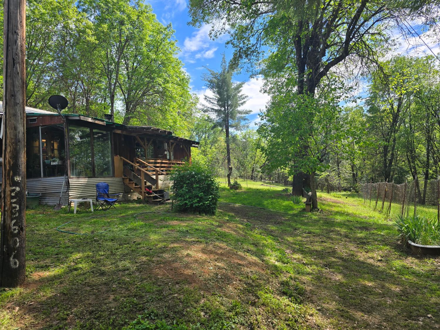 250 Acorn Way West Point, CA 95255 - Photo 27 of 32 a view of a house with a backyard and a tree
