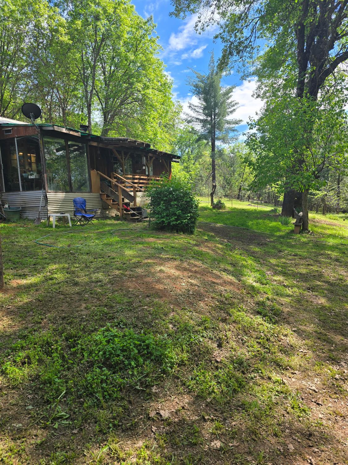 250 Acorn Way West Point, CA 95255 - Photo 29 of 32 a view of a house with a back yard