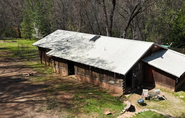 a view of a pool with a yard